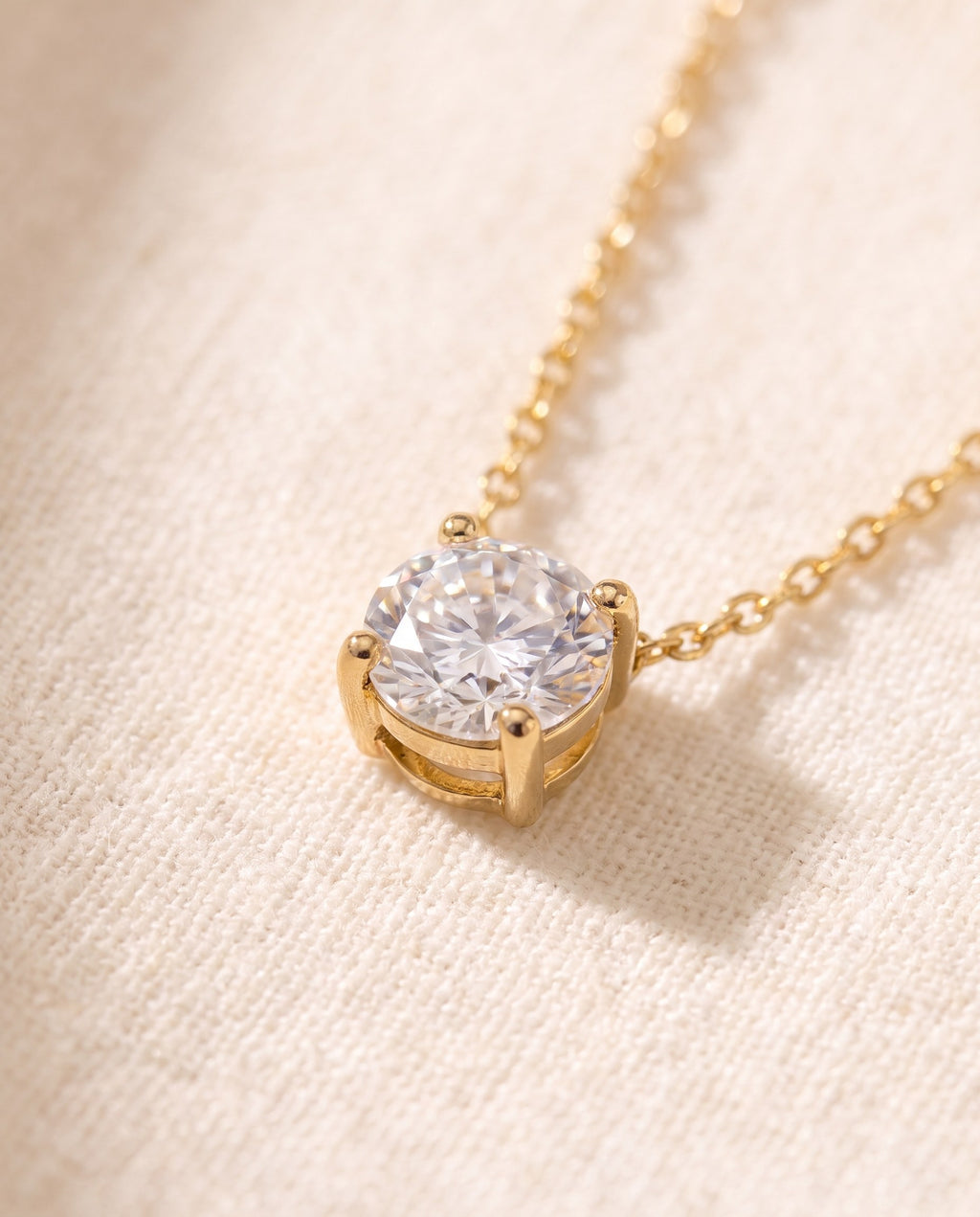Close-up of the four-claw setting holding the round cubic zirconia of the Solitaire Pendant Necklace